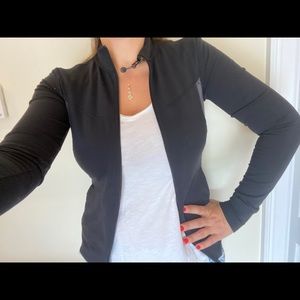 Form fitting dry fit Northface zip jacket SM blk